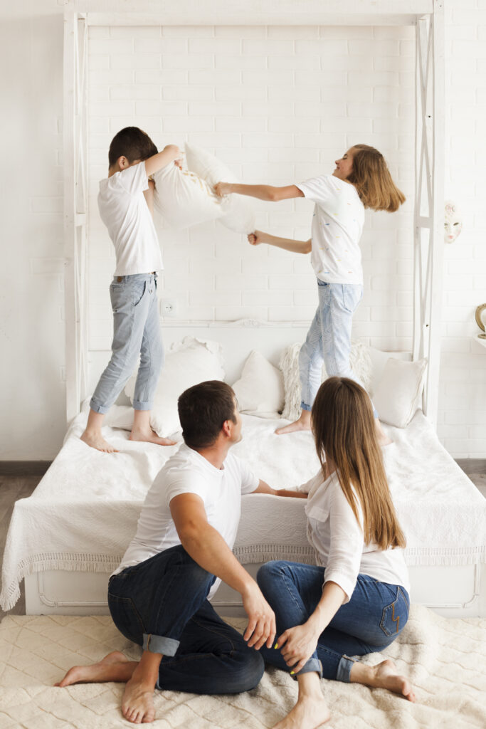 parent looking their kids fighting bed home